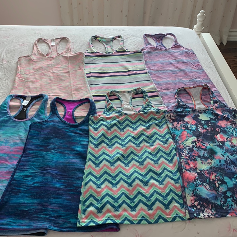 7 ivivva tank tops. Size 14, beautiful colours, brand new without tag